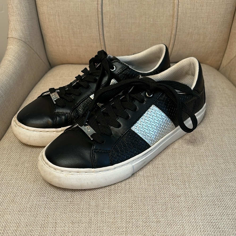 Calvin Klein women’s black/silver sneakers
